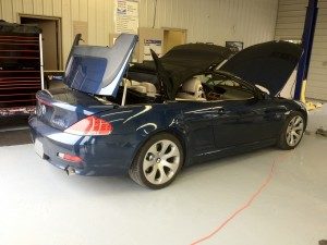 Repair of a convertible top on a BMW 645i.